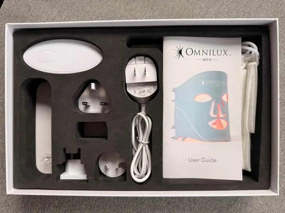 Man using Omnilux Men red light therapy face mask for skin rejuvenation and razor burn relief